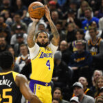 D.J. Augustin #4 of the Los Angeles Lakers shoots over Donovan Mitchell #45 of the Utah Jazz during the first half at Vivint Smart Home Arena on March 31, 2022 in Salt Lake City, Utah. NOTE TO USER: User expressly acknowledges and agrees that, by downloading and or using this photograph, User is consenting to the terms and conditions of the Getty Images License Agreement.