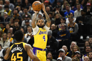 D.J. Augustin #4 of the Los Angeles Lakers shoots over Donovan Mitchell #45 of the Utah Jazz during the first half at Vivint Smart Home Arena on March 31, 2022 in Salt Lake City, Utah. NOTE TO USER: User expressly acknowledges and agrees that, by downloading and or using this photograph, User is consenting to the terms and conditions of the Getty Images License Agreement.