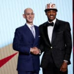 NBA commissioner Adam Silver (L) and Ochai Agbaji pose for photos after Agbaji was drafted with the 14th overall pick by the Cleveland Cavaliers during the 2022 NBA Draft at Barclays Center on June 23, 2022 in New York City.