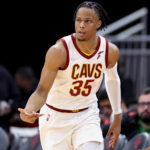 Isaac Okoro #35 of the Cleveland Cavaliers reacts to a three point basket during the first half against the Houston Rockets at Toyota Center on February 02, 2022 in Houston, Texas. NOTE TO USER: User expressly acknowledges and agrees that, by downloading and or using this photograph, User is consenting to the terms and conditions of the Getty Images License Agreement.