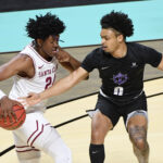 Clythus Griffith Jr. #0 of the Portland Pilots tries to knock the ball away from Jalen Williams #24 of the Santa Clara Broncos during the first round of the West Coast Conference basketball tournament at the Orleans Arena on March 4, 2021 in Las Vegas, Nevada. The Broncos defeated the Pilots 95-86.