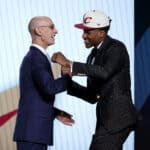 NBA commissioner Adam Silver (L) and Ochai Agbaji react after Agbaji was drafted with the 14th overall pick by the Cleveland Cavaliers during the 2022 NBA Draft at Barclays Center on June 23, 2022 in New York City. NOTE TO USER: User expressly acknowledges and agrees that, by downloading and or using this photograph, User is consenting to the terms and conditions of the Getty Images License Agreement.