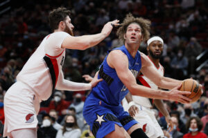 Robin Lopez #33 of the Orlando Magic shoots against Jusuf Nurkic #27 of the Portland Trail Blazers d1h at Moda Center on February 08, 2022 in Portland, Oregon. NOTE TO USER: User expressly acknowledges and agrees that, by downloading and/or using this photograph, User is consenting to the terms and conditions of the Getty Images License Agreement.
