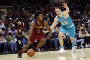 Collin Sexton #2 of the Cleveland Cavaliers dribbles on Gordon Hayward #20 of the Charlotte Hornets in the second half at Rocket Mortgage Fieldhouse on October 22, 2021 in Cleveland, Ohio. NOTE TO USER: User expressly acknowledges and agrees that, by downloading and or using this photograph, User is consenting to the terms and conditions of the Getty Images License Agreement.