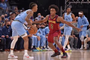 Collin Sexton #2 of the Cleveland Cavaliers guards Ja Morant #12 of the Memphis Grizzlies during the first quarter at FedExForum on October 20, 2021 in Memphis, Tennessee. NOTE TO USER: User expressly acknowledges and agrees that, by downloading and or using this photograph, User is consenting to the terms and conditions of the Getty Images License Agreement.