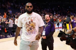 LeBron James #6 of the Los Angeles Lakers walks off the court following the NBA game against the Phoenix Suns at Footprint Center on April 05, 2022 in Phoenix, Arizona. The Suns defeated the Lakers 121-110. NOTE TO USER: User expressly acknowledges and agrees that, by downloading and or using this photograph, User is consenting to the terms and conditions of the Getty Images License Agreement.