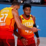 Donovan Mitchell #45 talks with Rudy Gobert #27 of the Utah Jazz during the first quarter against the Denver Nuggets in Game Four of the Western Conference First Round during the 2020 NBA Playoffs at AdventHealth Arena at ESPN Wide World Of Sports Complex on August 23, 2020 in Lake Buena Vista, Florida.