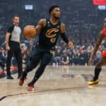 Donovan Mitchell #45 of the Cleveland Cavaliers dribbles against OG Anunoby #3 of the Toronto Raptors during their NBA game at Scotiabank Arena on October 19, 2022 in Toronto, Canada.