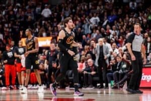Cedi Osman #16 of the Cleveland Cavaliers reacts to a referee's call during the second half of their NBA game against the Toronto Raptors at Scotiabank Arena on October 19, 2022 in Toronto, Canada.