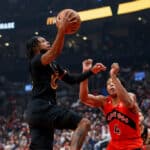 Darius Garland #10 of the Cleveland Cavaliers drives to the net against Scottie Barnes #4 of the Toronto Raptors during the first half of their NBA game at Scotiabank Arena on October 19, 2022 in Toronto, Canada.