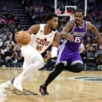 Donovan Mitchell #45 of the Cleveland Cavaliers is guarded by Davion Mitchell #15 of the Sacramento Kings in the second half at Golden 1 Center on November 09, 2022 in Sacramento, California.