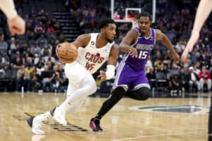 Donovan Mitchell #45 of the Cleveland Cavaliers is guarded by Davion Mitchell #15 of the Sacramento Kings in the second half at Golden 1 Center on November 09, 2022 in Sacramento, California.