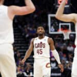 Donovan Mitchell #45 of the Cleveland Cavaliers talks to Kevin Love #0 and Dean Wade #32 of the Cleveland Cavaliers during their game against the Sacramento Kings at Golden 1 Center on November 09, 2022 in Sacramento, California.