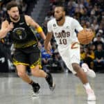 Darius Garland #10 of the Cleveland Cavaliers dribbles the ball past Klay Thompson #11 of the Golden State Warriors in the second quarter of an NBA basketball game at Chase Center on November 11, 2022 in San Francisco, California.