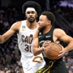 Stephen Curry #30 of the Golden State Warriors drives to the basket on Jarrett Allen #31 of the Cleveland Cavaliers in the fourth quarter of an NBA basketball game at Chase Center on November 11, 2022 in San Francisco, California.