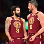 Ricky Rubio #3 talks with Kevin Love #0 of the Cleveland Cavaliers during the third quarter against the Miami Heat at Rocket Mortgage Fieldhouse on December 13, 2021 in Cleveland, Ohio. The Cavaliers defeated the Heat 105-94.
