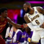 LeBron James #6 of the Los Angeles Lakers controls the ball against Caris LeVert #3 of the Cleveland Cavaliers in the second quarter at Crypto.com Arena on November 06, 2022 in Los Angeles, California.