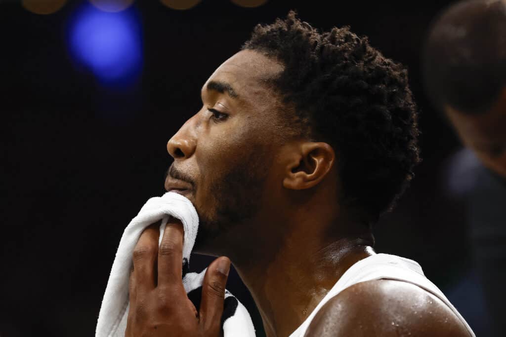 BOSTON, MASSACHUSETTS - NOVEMBER 19: Donovan Mitchell #45 of the Cleveland Cavaliers dries his face on the bench while playing the during the third quarter of the Emirates NBA Cup at TD Garden on November 19, 2024 in Boston, Massachusetts.