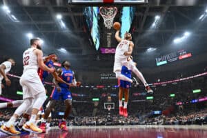 CLEVELAND, OHIO - OCTOBER 25: Jarrett Allen #31 of the Cleveland Cavaliers dunks over Cade Cunningham #2 of the Detroit Pistons during the first quarter at Rocket Mortgage Fieldhouse on October 25, 2024 in Cleveland, Ohio. The Cavaliers defeated the Pistons 113-101. NOTE TO USER: User expressly acknowledges and agrees that, by downloading and or using this photograph, User is consenting to the terms and conditions of the Getty Images License Agreement.