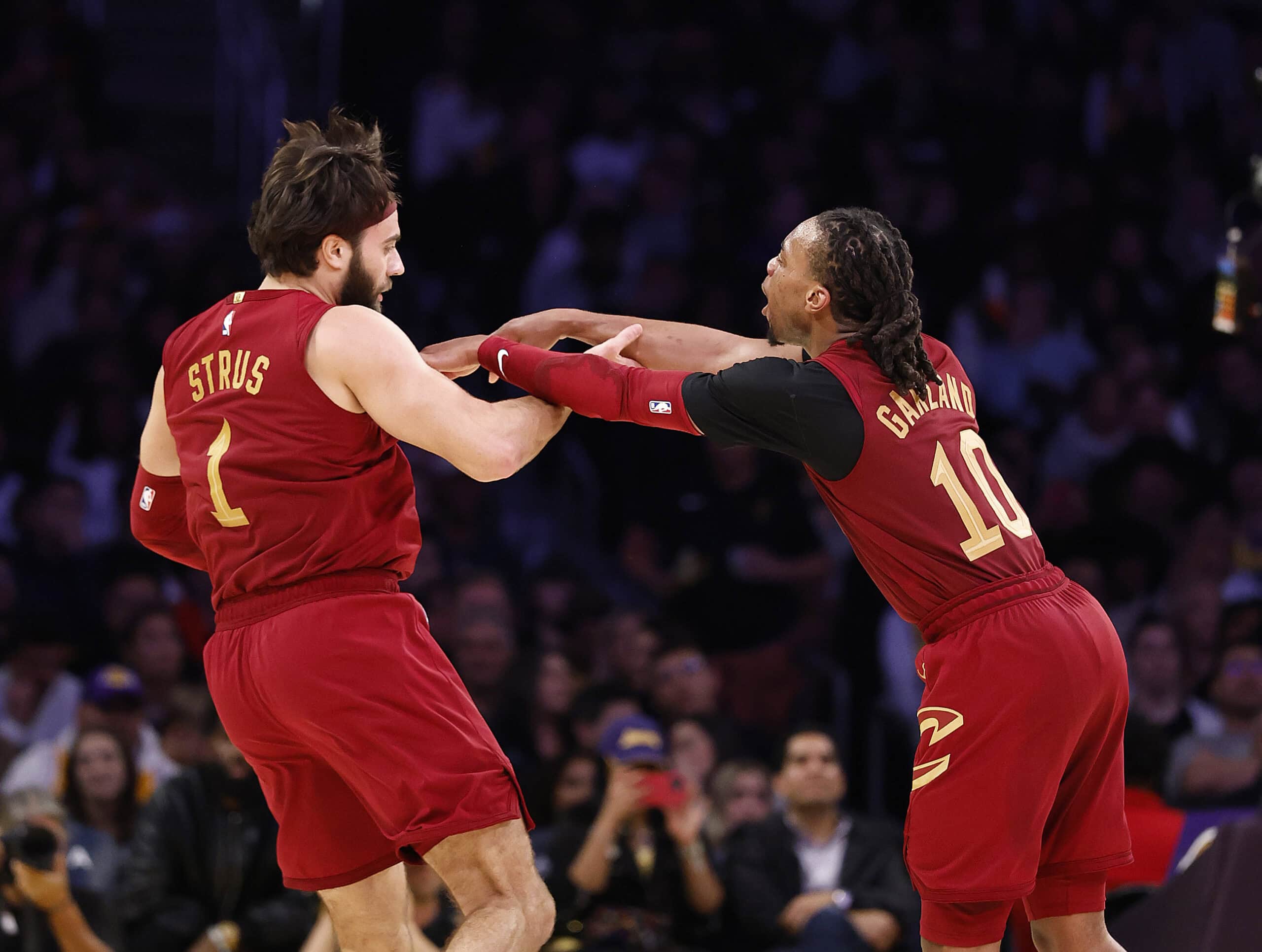 LOS ANGELES, CALIFORNIA - DECEMBER 31: Max Strus #1 of the Cleveland Cavaliers celebrates a three-point shot with Darius Garland #10 of the Cleveland Cavaliers in the second half against the Los Angeles Lakers at Crypto.com Arena on December 31, 2024 in Los Angeles, California. NOTE TO USER: User expressly acknowledges and agrees that, by downloading and or using this photograph, User is consenting to the terms and conditions of the Getty Images License Agreement.