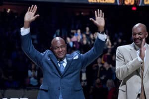 CLEVELAND, OHIO - OCTOBER 26: Former Cavaliers greats Austin Carr, left, and Larry Nance, right, wave to the crowd during a celebration for the Cavaliers 50th anniversary prior to the game against the Indiana Pacers at Rocket Mortgage Fieldhouse on October 26, 2019 in Cleveland, Ohio.