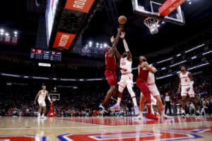 HOUSTON, TEXAS - MARCH 16: Caris LeVert #3 of the Cleveland Cavaliers drives to the net against Jeff Green #32 of the Houston Rockets during the first half at Toyota Center on March 16, 2024 in Houston, Texas.