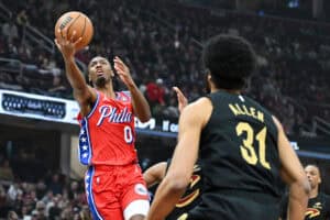 CLEVELAND, OHIO - DECEMBER 21: Tyrese Maxey #0 of the Philadelphia 76ers shoots against Jarrett Allen #31 of the Cleveland Cavaliers during the first half at Rocket Mortgage Fieldhouse on December 21, 2024 in Cleveland, Ohio.