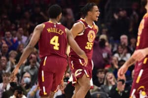 CLEVELAND, OHIO - DECEMBER 13: Evan Mobley #4 and Isaac Okoro #35 of the Cleveland Cavaliers celebrate after scoring during the second quarter against the Miami Heat at Rocket Mortgage Fieldhouse on December 13, 2021 in Cleveland, Ohio.