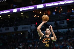 CHARLOTTE, NORTH CAROLINA - MARCH 27: Georges Niang #20 of the Cleveland Cavaliers attempts a shot during the second half of the game against the Charlotte Hornets at Spectrum Center on March 27, 2024 in Charlotte, North Carolina.