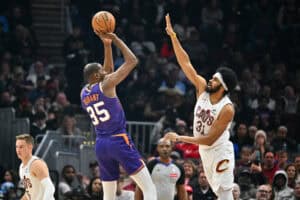 CLEVELAND, OHIO - JANUARY 20: Kevin Durant #35 of the Phoenix Suns shoots over Jarrett Allen #31 of the Cleveland Cavaliers during the second quarter at Rocket Mortgage Fieldhouse on January 20, 2025 in Cleveland, Ohio.