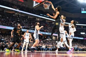CLEVELAND, OHIO - FEBRUARY 02: Jarrett Allen #31 of the Cleveland Cavaliers dunks over Brandon Clarke #15 of the Memphis Grizzlies during the second quarter at Rocket Mortgage Fieldhouse on February 02, 2023 in Cleveland, Ohio.