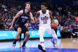 ORLANDO, FLORIDA - FEBRUARY 25: De'Andre Hunter #12 of the Cleveland Cavaliers dribbles the ball against Franz Wagner #22 of the Orlando Magic during the fourth quarter at Kia Center on February 25, 2025 in Orlando, Florida.