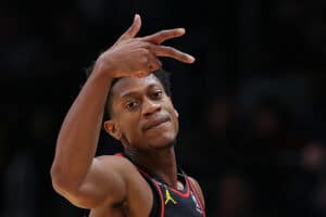 ATLANTA, GEORGIA - NOVEMBER 16: De'Andre Hunter #12 of the Atlanta Hawks reacts after hitting a three-point basket against the Boston Celtics during the first half at State Farm Arena on November 16, 2022 in Atlanta, Georgia.