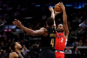 INGLEWOOD, CALIFORNIA - MARCH 18: Kawhi Leonard #2 of the Los Angeles Clippers shoots against Donovan Mitchell #45 and Evan Mobley #4 of the Cleveland Cavaliers during the fourth quarter at Intuit Dome on March 18, 2025 in Inglewood, California.