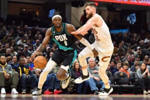 CLEVELAND, OHIO - NOVEMBER 23: Jerami Grant #9 of the Portland Trail Blazers drives to the basket around Dean Wade #32 of the Cleveland Cavaliers during the second quarter at Rocket Mortgage Fieldhouse on November 23, 2022 in Cleveland, Ohio.