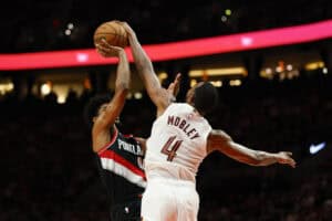 PORTLAND, OREGON - MARCH 25: Evan Mobley #4 of the Cleveland Cavaliers blocks Scoot Henderson #00 of the Portland Trail Blazers shot during the fourth quarter of the game at the Moda Center on March 25, 2025 in Portland, Oregon. The Cleveland Cavaliers won 122-111.