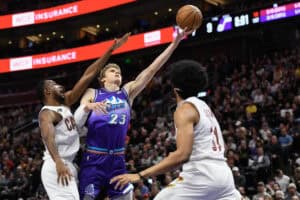 SALT LAKE CITY, UTAH - JANUARY 10: Lauri Markkanen #23 of the Utah Jazz shoots over Evan Mobley #4 of the Cleveland Cavaliers during the first half at Vivint Arena on January 10, 2023 in Salt Lake City, Utah.