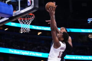 ORLANDO, FLORIDA - FEBRUARY 25: De'Andre Hunter #12 of the Cleveland Cavaliers goes up for a shot against Paolo Banchero #5 of the Orlando Magic during the third quarter at Kia Center on February 25, 2025 in Orlando, Florida.