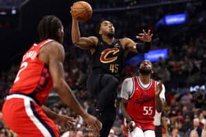 INGLEWOOD, CALIFORNIA - MARCH 18: Donovan Mitchell #45 of the Cleveland Cavaliers drives to the basket against Kawhi Leonard #2 and Derrick Jones Jr. #55 of the Los Angeles Clippers during the second quarter at Intuit Dome on March 18, 2025 in Inglewood, California.