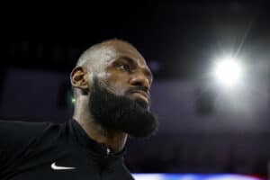 CHICAGO, ILLINOIS - MARCH 27: LeBron James #23 of the Los Angeles Lakers looks on during the playing of the national anthem prior to the game against the Chicago Bulls at the United Center on March 27, 2025 in Chicago, Illinois.
