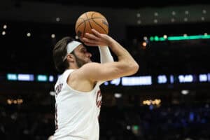 MILWAUKEE, WISCONSIN - MARCH 09: Max Strus #1 of the Cleveland Cavaliers takes a three point shot during the first half of a game against the Milwaukee Bucks at Fiserv Forum on March 09, 2025 in Milwaukee, Wisconsin.