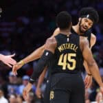 MIAMI, FLORIDA - APRIL 28: Donovan Mitchell #45 and Jarrett Allen #31 of the Cleveland Cavaliers celebrate against the Miami Heat during the first quarter in Game Four of the Eastern Conference First Round NBA Playoffs at Kaseya Center on April 28, 2025 in Miami, Florida.