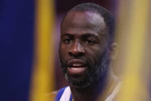 PHOENIX, ARIZONA - APRIL 08: Draymond Green #23 of the Golden State Warriors on the bench during the NBA game at PHX Arena on April 08, 2025 in Phoenix, Arizona.