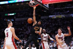 MIAMI, FLORIDA - APRIL 26: Jarrett Allen #31 of the Cleveland Cavaliers dunks the ball against Nikola Jovic #5 of the Miami Heat during the second quarter in Game Three of the Eastern Conference First Round NBA Playoffs at Kaseya Center on April 26, 2025 in Miami, Florida.