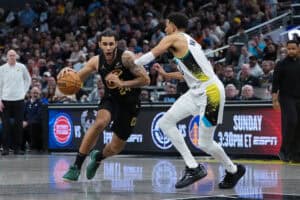 INDIANAPOLIS, INDIANA - APRIL 10: Jaylon Tyson #24 of the Cleveland Cavaliers dribbles the ball while being guarded by hat Gainbridge Fieldhouse on April 10, 2025 in Indianapolis, Indiana.