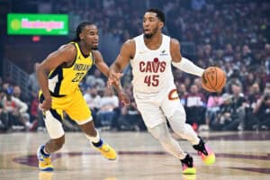 CLEVELAND, OHIO - MAY 04: Aaron Nesmith #23 of the Indiana Pacers guards Donovan Mitchell #45 of the Cleveland Cavaliers during the first quarter of game one of the Eastern Conference Semifinals at Rocket Arena on May 04, 2025 in Cleveland, Ohio.