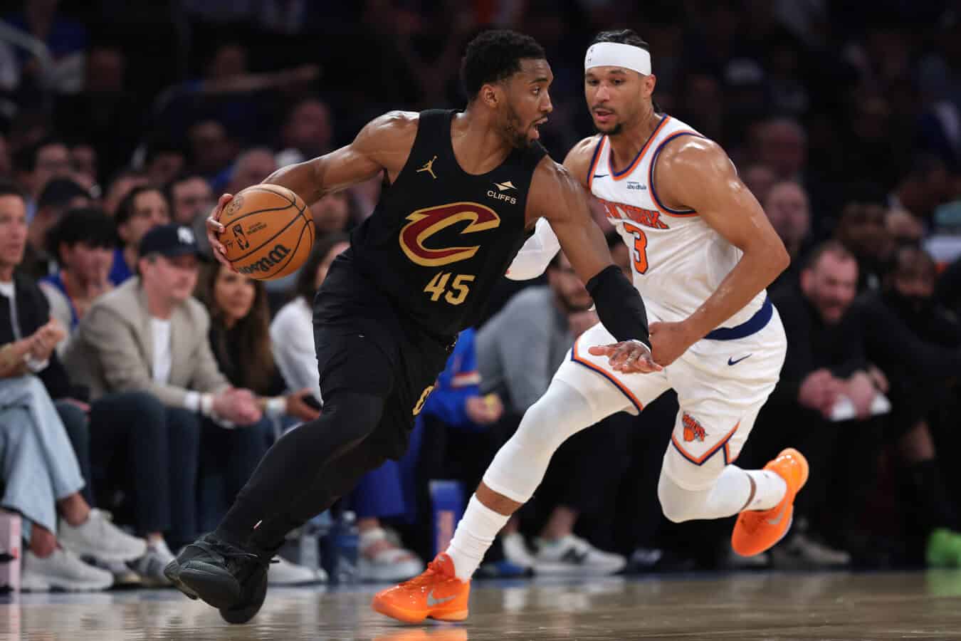 NEW YORK, NEW YORK - MAY 19: Donovan Mitchell #45 of the Cleveland Cavaliers drives around Josh Hart #3 of the New York Knicks during the third quarter in Game One of the NBA Eastern Conference Finals at Madison Square Garden on May 19, 2026 in New York City. NOTE TO USER: User expressly acknowledges and agrees that, by downloading and or using this photograph, User is consenting to the terms and conditions of the Getty Images License Agreement.